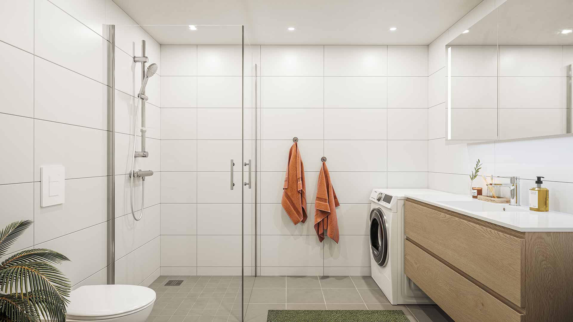 Illustrasjon av baderom. Badet inneholder dusj, toalett, vaskemaskin og servantmøbel. Hvite store fliser på veggene, lysegrå fliser på gulvet. Baderomsinnredning i lyst tre og speil med integrert lys.